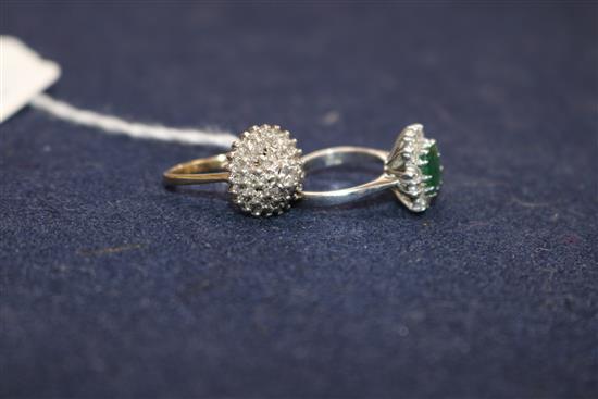 An 18ct white gold, emerald and diamond cluster ring and a 9ct gold and diamond cluster ring.